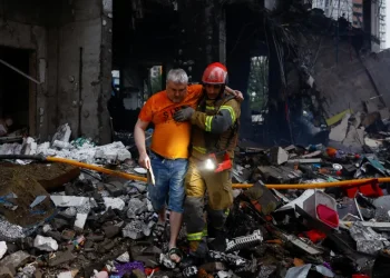 Photo credit: Reuters.
Kyiv emergency services were pulling survivors out of bombed-out buildings following early morning strikes on Monday